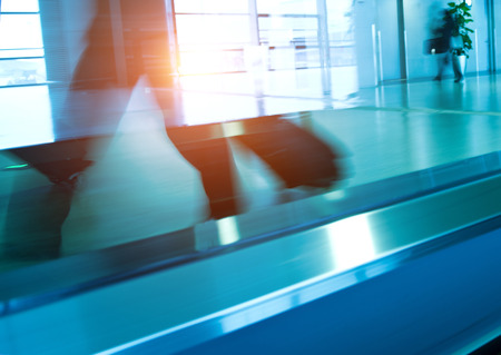 movement of abstract escalator with people.の写真素材