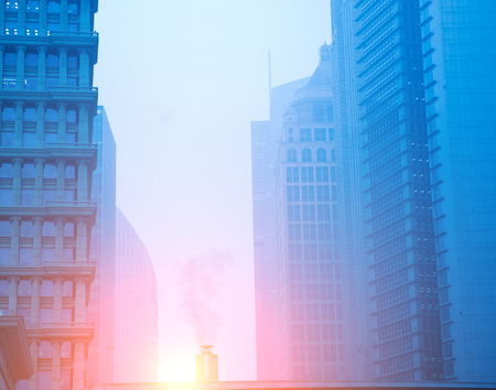 Smoke coming out from the buildings in winter.の写真素材