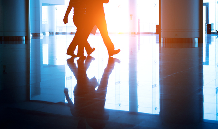 Business people rushing in the lobby. motion blurの写真素材