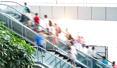 People rush on escalator motion blurred.のeditorial素材
