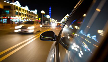 night drive ,shoot from the window of speed car, motion blur steet light.の写真素材