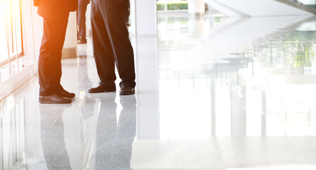 Low section of two businesspeople standing together.の写真素材