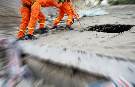 Search and rescue forces search through a destroyed building.の写真素材