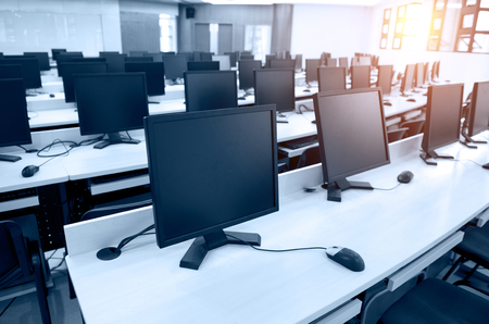 Group of computer neatly placed in a computer lab.のeditorial素材