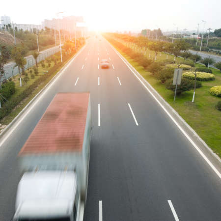 Highway with cars and trucks. motion blurの写真素材