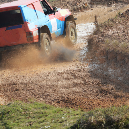 Driver competing in an off-road 4x4 competition.の写真素材