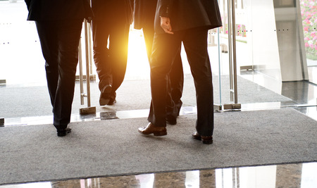 Low section of businesspeople walking together.の写真素材