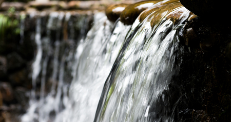 Landscape with a waterfall in a summer day.の写真素材