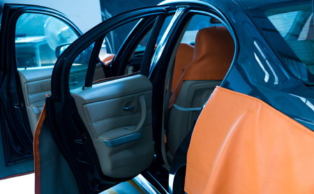 Car in auto repair shop with open hood.のeditorial素材
