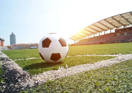 soccer ball on stadium grass line.のeditorial素材