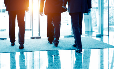 Low section of businesspeople walking together.の写真素材