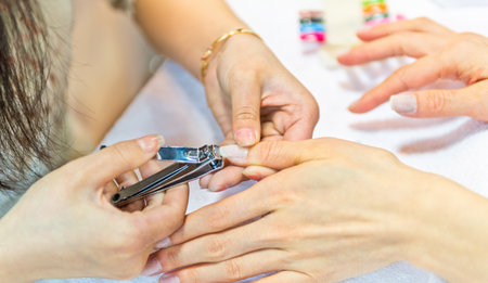 Asian woman in a beauty salon making nailsの写真素材