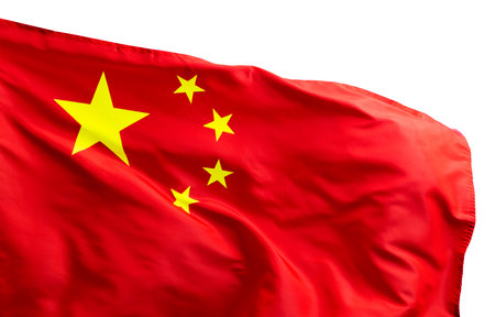 Chinese flag on pole waving in the wind against white backgroundの写真素材