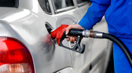 Woman hand refilling the car with fuelの写真素材