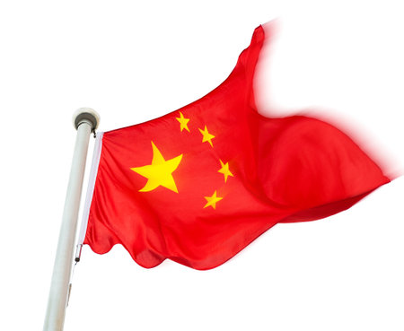 Chinese flag on pole waving in the wind against white backgroundの写真素材