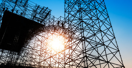 Group of construction workers working on scaffoldingの写真素材