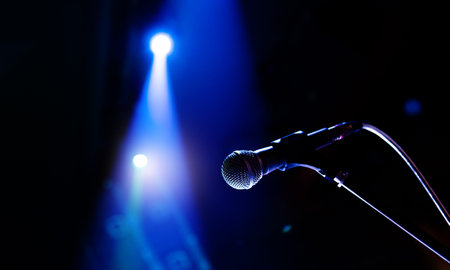 Close up of single microphone in concert hallの写真素材