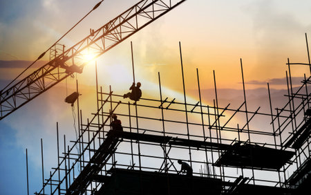 Group of construction workers working on scaffoldingの写真素材