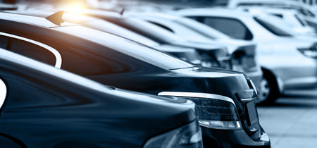 Large group of cars parked in a rowの写真素材