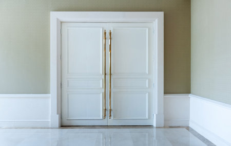 Closed white door in a luxury hotelの写真素材