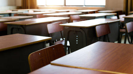 Empty classroom with chairs and desksの写真素材