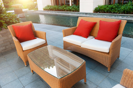 Comfortable house patio with table, chairs and poolの写真素材