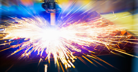 Laser cutting of metal with sparksの写真素材