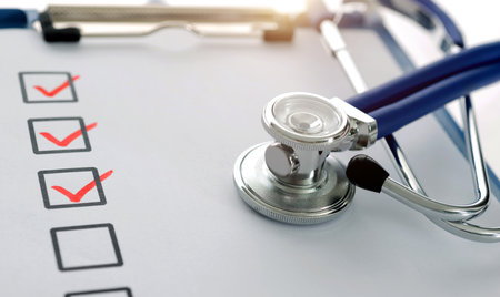 Medical clipboard with checklist and stethoscopeの写真素材