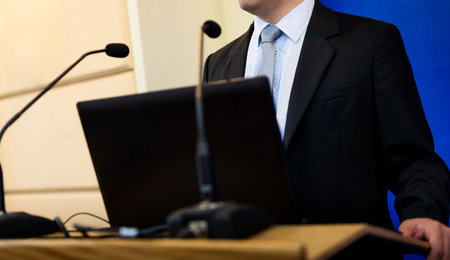 Business man making speech at conference hallの写真素材