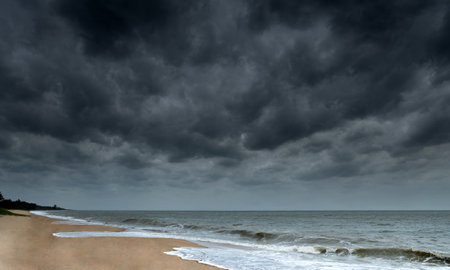 Storm seascape with dark rainy cloudsの写真素材