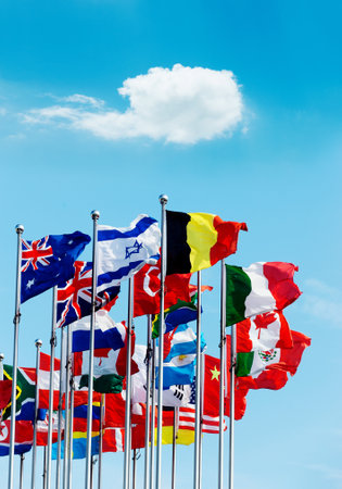 Set of flags fluttering in the wind against blue sky backgroundの写真素材