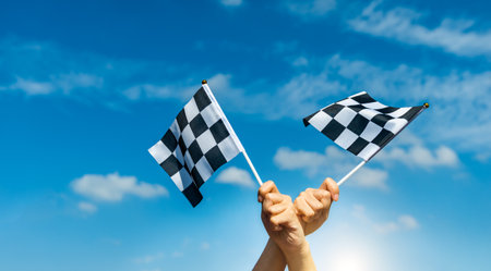 Two checkered race flags in handの写真素材