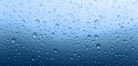 Rain drops on car body with shallow focusの写真素材