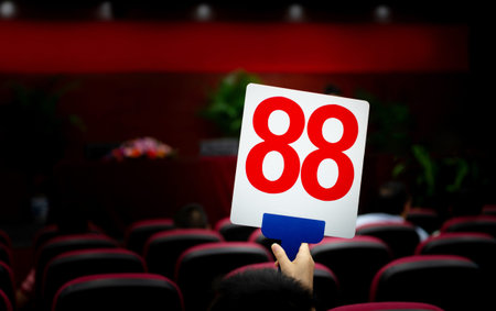 People holding up customer number pacing a bid