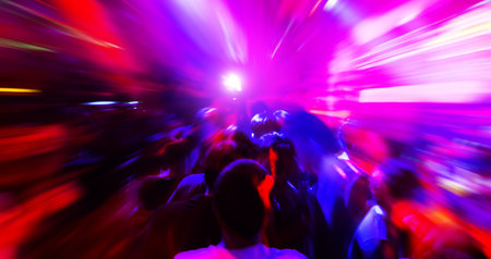 Dancing people in a disco club to the musicの写真素材