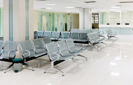 Hospital waiting room with many chairsの写真素材