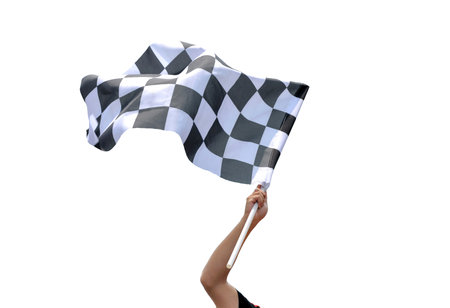 Checkered race flag in hand against white backgroundの写真素材