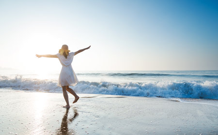 Young woman having fun at seasideの写真素材