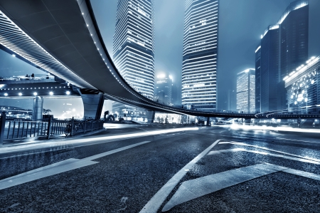 the light trails on the modern building background in shanghai china の写真素材