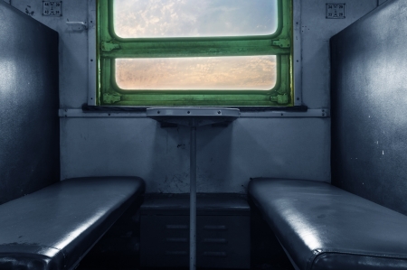 inside train and empty chair beside window,vintageの写真素材