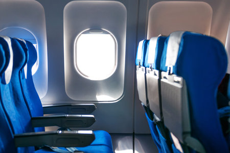 Empty aircraft seats and windows.