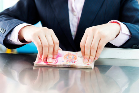 Female hands counting money