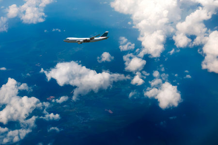 airplane and blue cloudy skyの写真素材