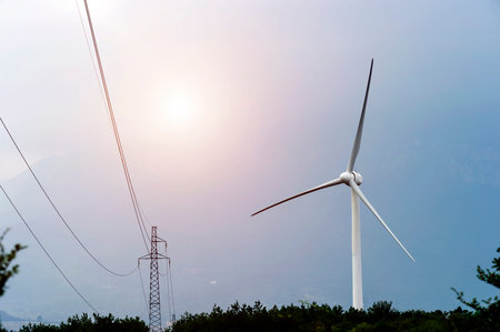 Wind turbine against mountain
