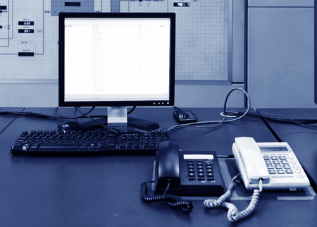 Computer and phone on the table in the labの写真素材