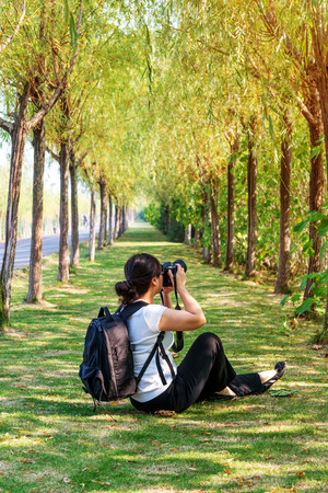 park walkway,the young female photographer is photoingの写真素材