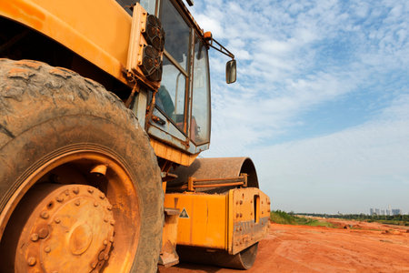 Large road-roller paving a road. Road construction