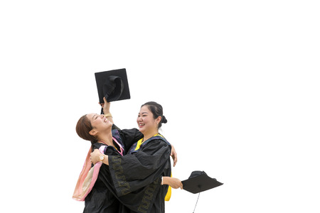 Beautiful female graduate wearing graduation gownの写真素材