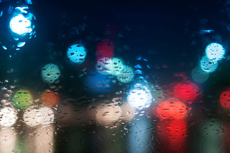 Wet the window with the background of the night city