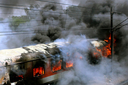 Six coaches of two premium trains ï¿½ the Bhubaneshwar and Sealdah Rajdhanis ï¿½ parked in the yard at New Delhi railway station were gutted in a fire on TuesdayPHOTO BY---VIPINの写真素材